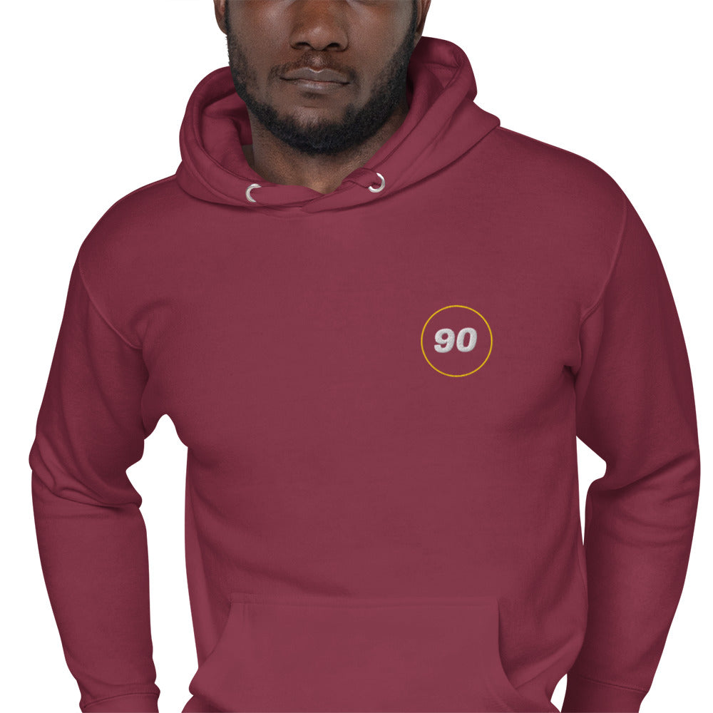 Maroon hoodie with a logo on the chest against a white background | colour:maroon
